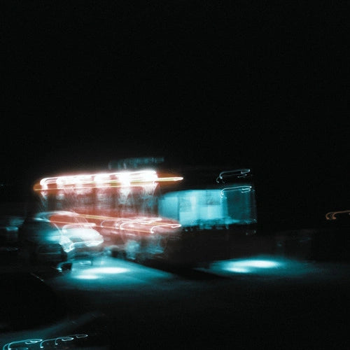 Cover art for the song "Tuesday" by Lithe. Blurred image of a bus at night with bright lights, reflecting the artist's mysterious and ethereal aesthetic. Released in 2023.